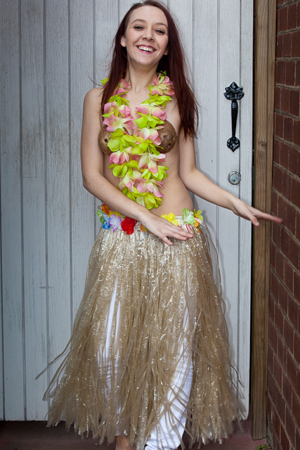 floor length grass skirt with floral waist band coconut bra and lei